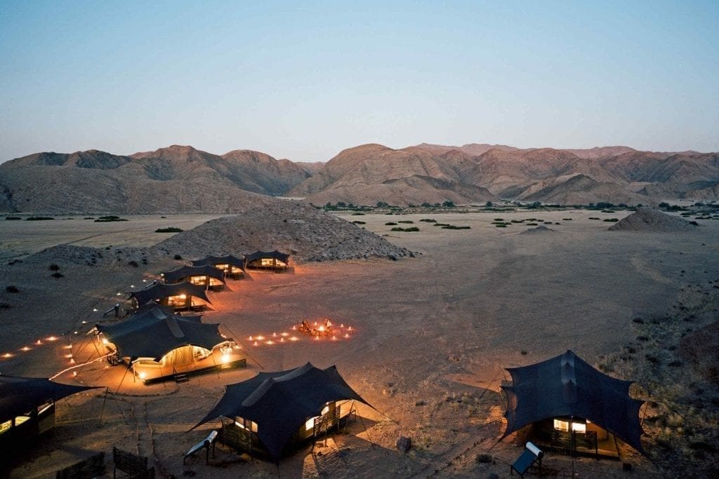 Hoanib Valley Camp at dusk in Namibia. The country is attracting a wider audience, including high-end travelers seeking the ultimate luxury: solitude.