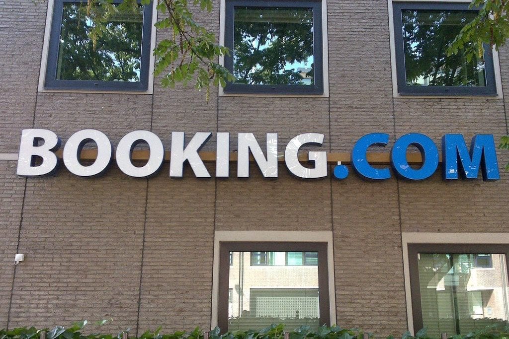 Pictured is a photo of Booking.com's Amsterdam headquarters. Booking Holdings has a lot of cash to use once a coronavirus recovery takes place.