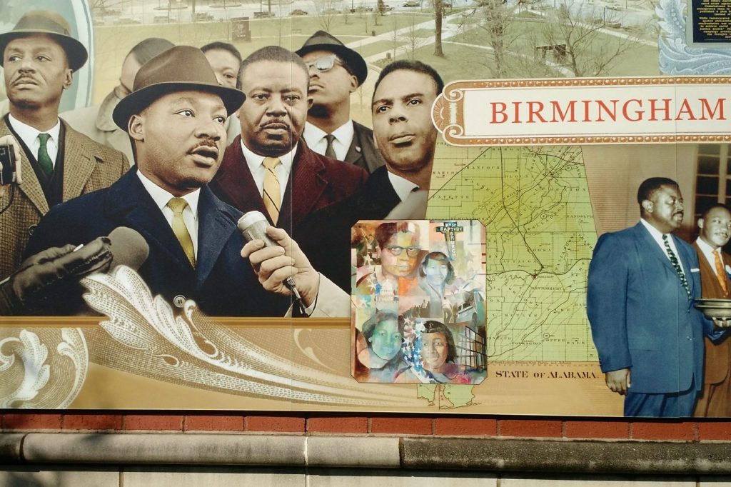 Pictured is a civil rights mural in Birmingham, Alabama. Civil rights tourism is trending for American vacationers.