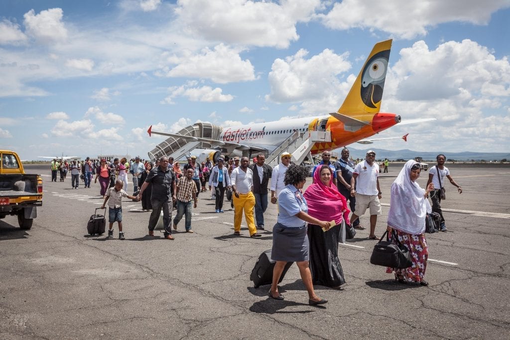 Passengers disembark a Fastjet flight. The company has switched from flying Airbus A319 aircraft to a fleet of smaller Embraer ERJ145s.