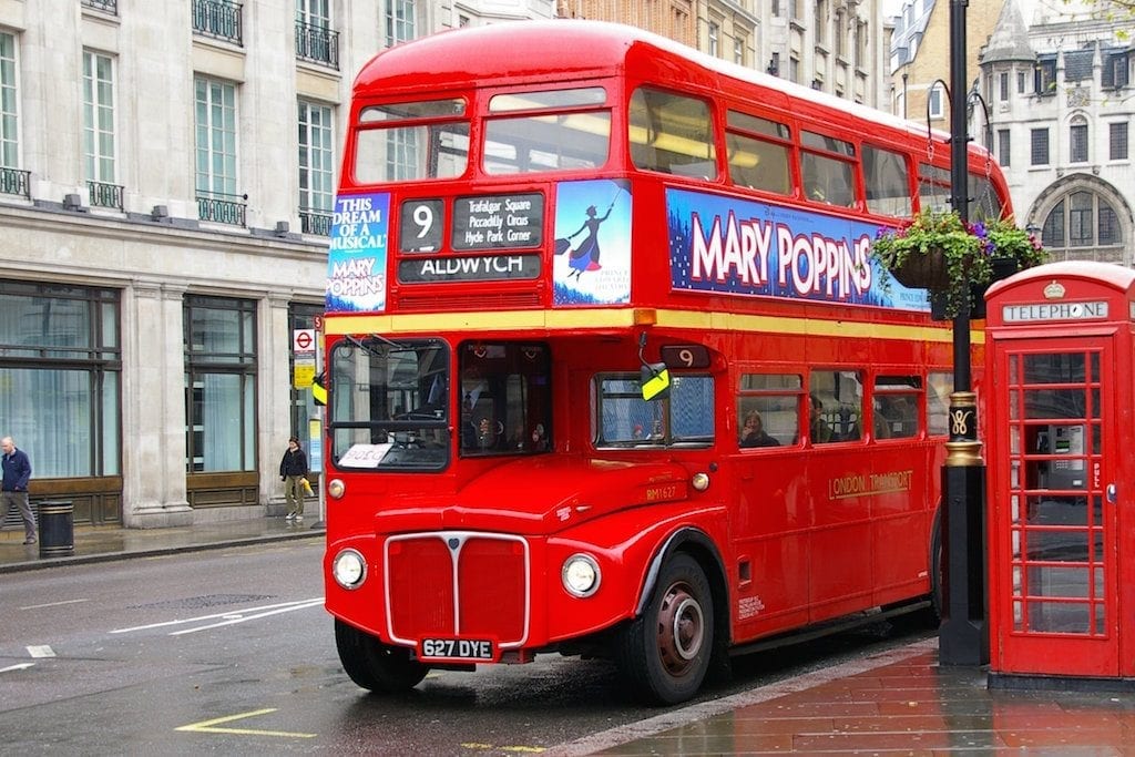 One of London's iconic double-decker buses and red telephone booth. 