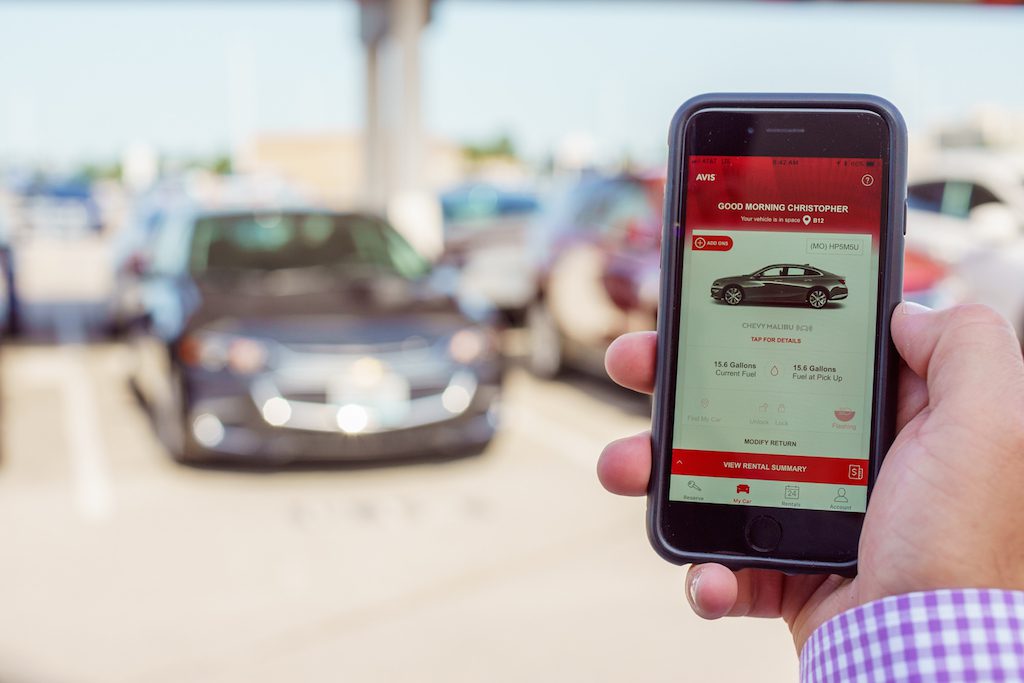 An Avis customer uses the Avis app. The company has been investing heavily in digital technology.