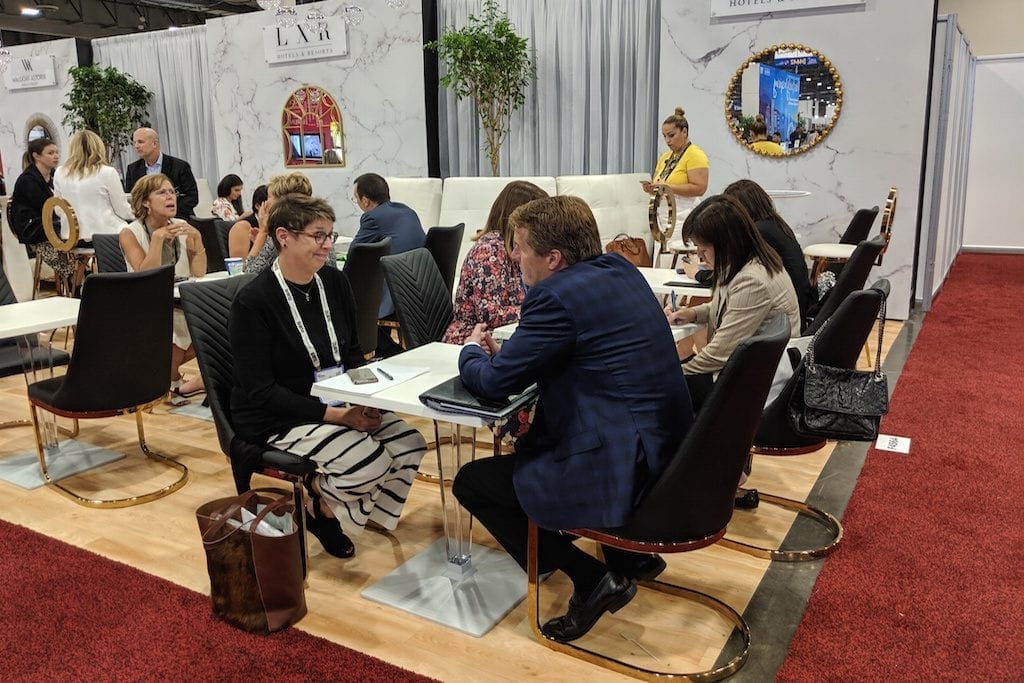 Event attendees meet with one another. IMEX America 2019, Sands Expo, Las Vegas.