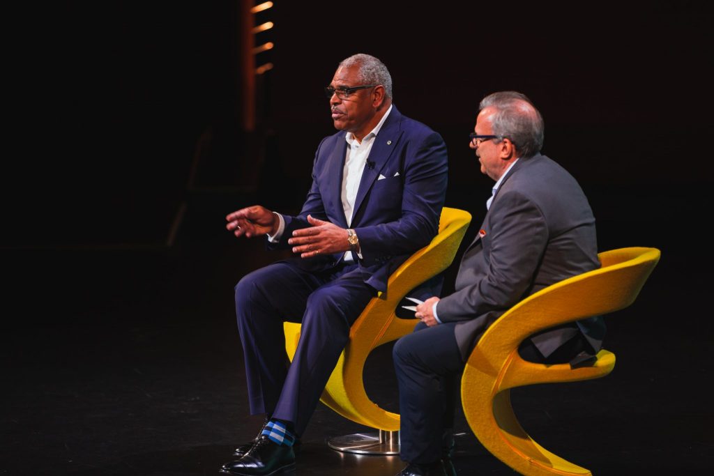 Arnold Donald (left), president and CEO of Carnival Corporation, speaking at Skift Global Forum on September 18, 2019, in New York City. 