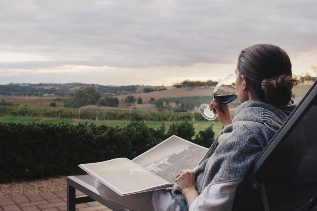 A traveler lounges in the private terrace of The Louise, Barossa Valley, Australia. Australia has become too dependent on Chinese inbound travelers, and now it's reckoning with a tourist slump.