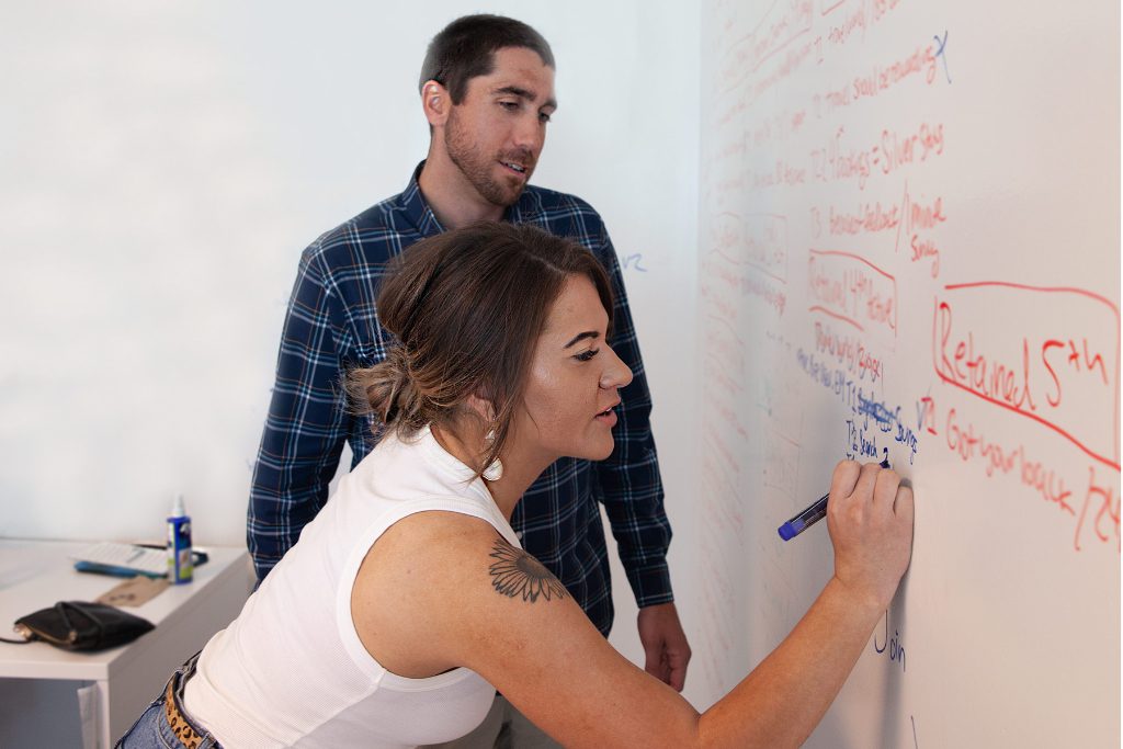 A whiteboarding scene from the new Denver headquarters of Hotel Engine, a startup that offers online lodging management for businesses. Hotel Engine has raised $16 million in Series A funding.