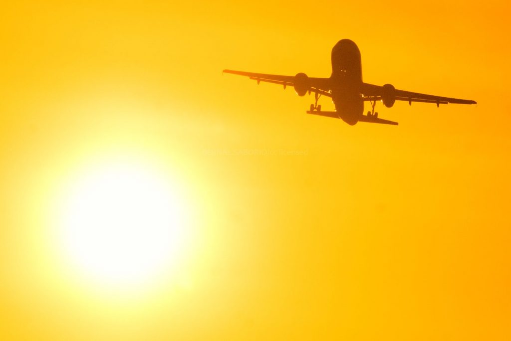 The sun and an aircraft. The CEO of IATA wants government help not new taxes.