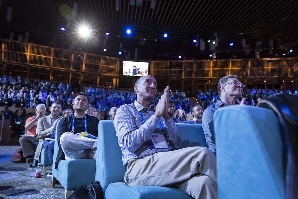 Attendees clapping at a TED conference in 2015.