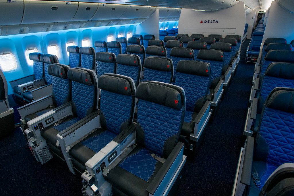 Delta flight cabin. The airline has launched SkyMile Select, a new subscription that offers priority boarding, indirectly including first dibs on overhead bin access.