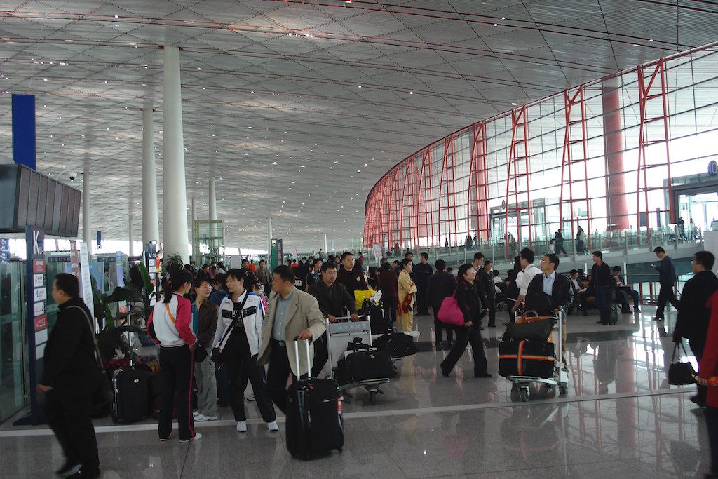 A file photo of business travelers at Beijing International Airport. United is considering when to add more flights to China.