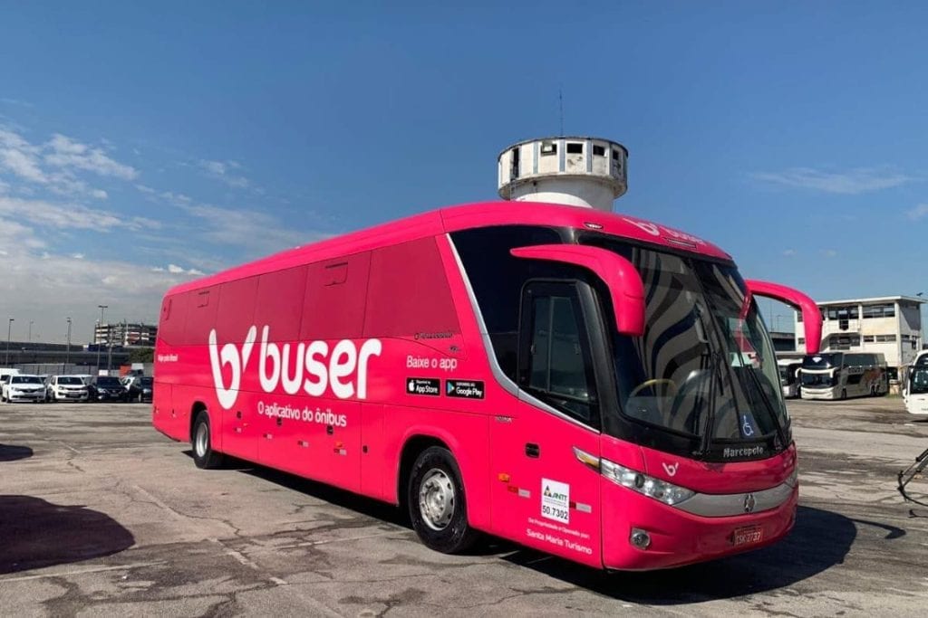 A Buser intercity charter bus is shown here in a parking lot in Brazil's capital city of São Paulo in early 2019. Buser is a startup that plays matchmaker with travelers looking for intercity travel in Brazil and charter companies that can respond on-demand.