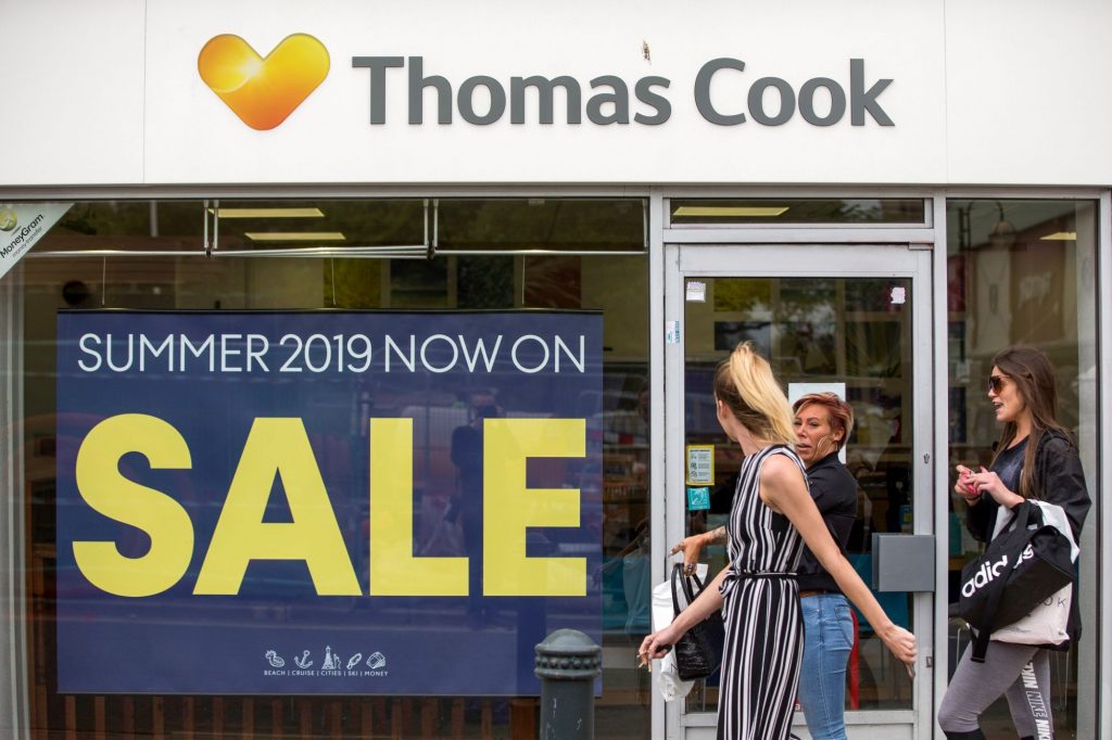Pictured is a sale in a Thomas Cook shop. Two former CEOs went before UK Parliament to explain the reasons behind the company's collapse.