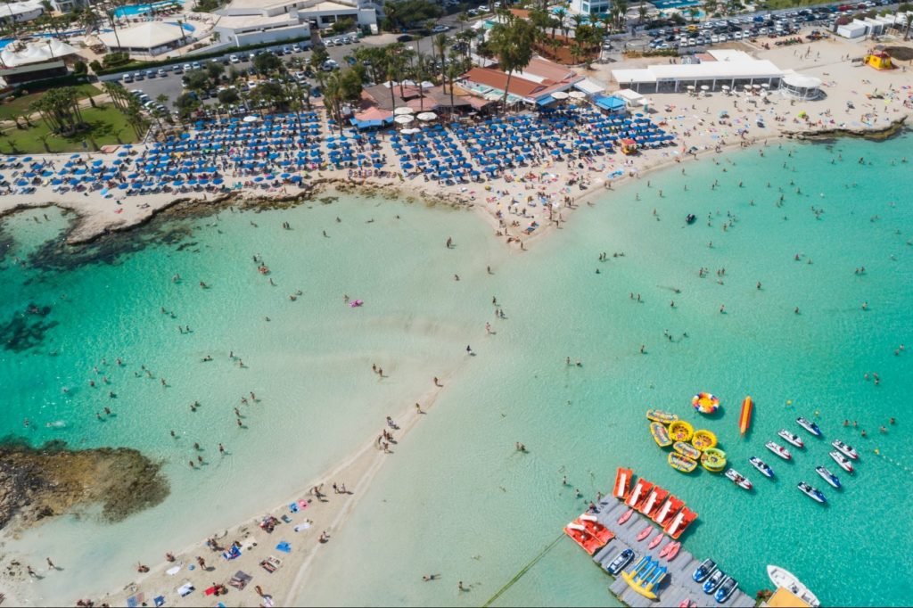An aerial photograph of Nissi beach Agia Napa, Cyprus. On the Beach has taken a financial hit from the Collapse of Thomas Cook.