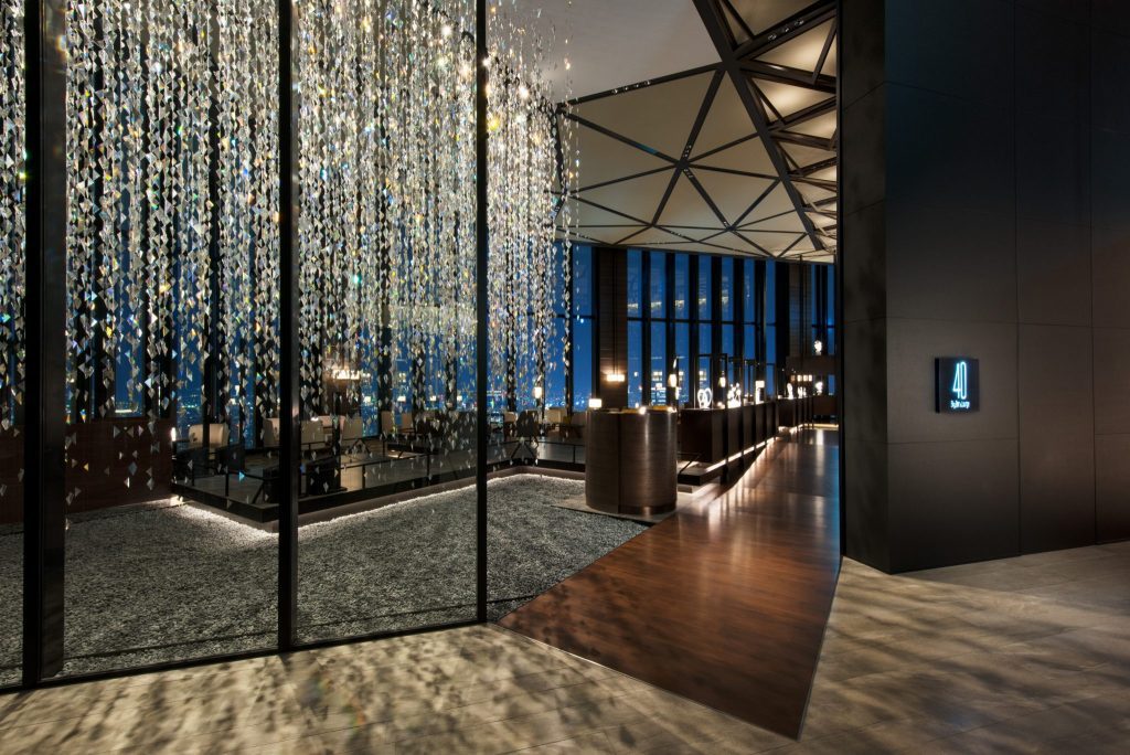 The Conrad Osaka 40 Sky Bar and Lounge. The use of cool elements like steel, glass, and metal in hotel architecture could help convey a sense of luxury.