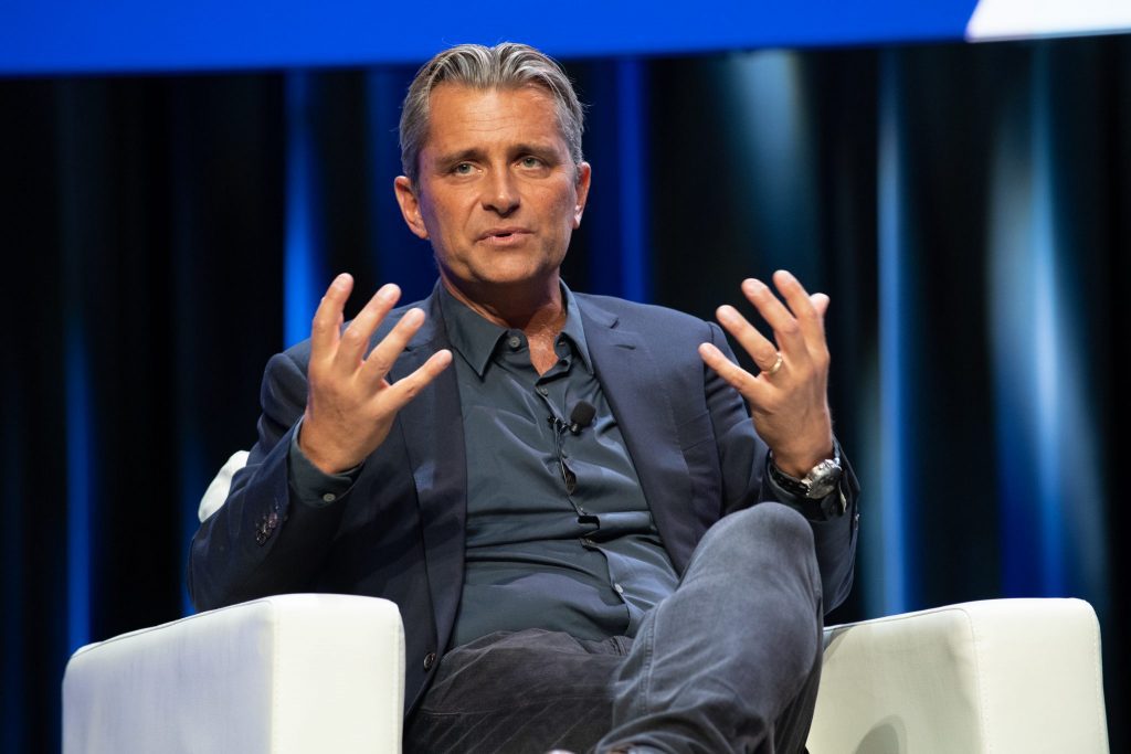 Expedia Travel Partners Group President Cyril Ranque at the company's partner conference in 2019. The group will be subject to additional layoffs.