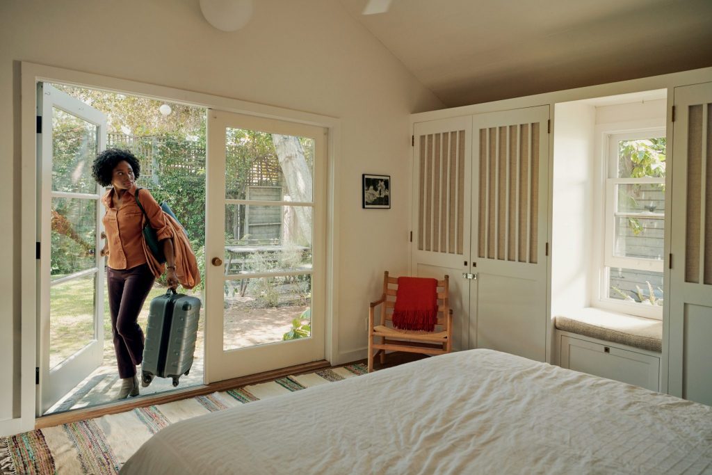 An image of a traveler staying at lodging that's part of the Airbnb for Work program. Business travel is set to rebound as the pandemic wanes, and Mondee, a travel tech company, has bought Rocketrip, a New York City-based startup that incentivizes employees to restrain their business travel spending.