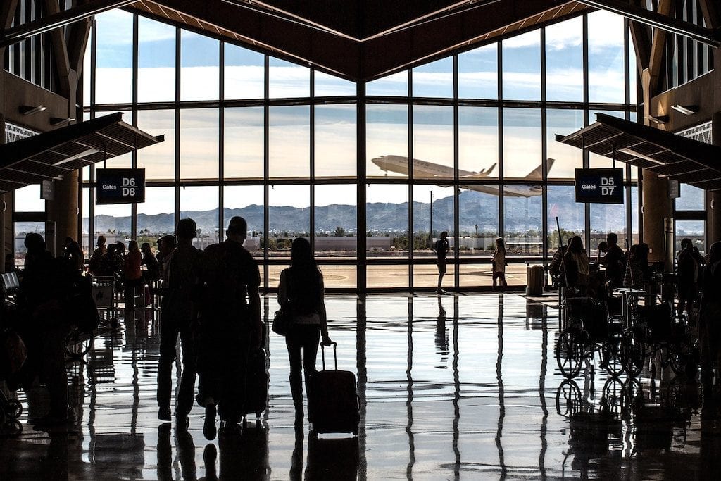 Travelers wait in terminal 4 at the Sky Harbor International Airport in Phoenix, Arizona.