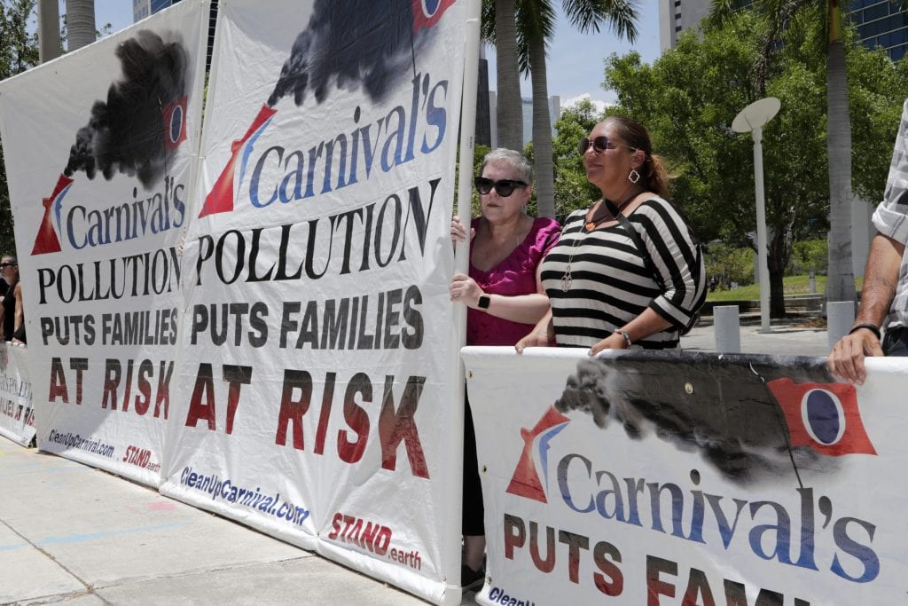 Protesters in Miami in opposition to Carnival Corp. New rules to reduce the amount of pollution in the ocean are set to be put into effect on Jan. 1.