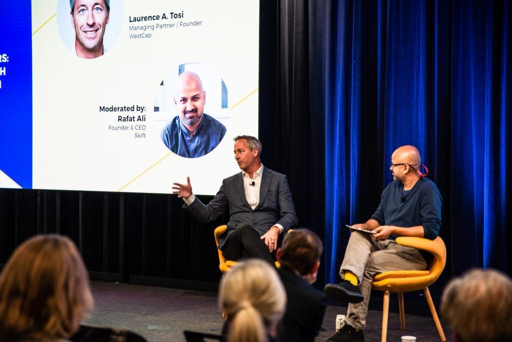 Laurence "L.T." A. Tosi (left), WestCap founder and managing partner, speaks on stage at Skift Short-Term Rental Summit in New York City on December 5, 2019
