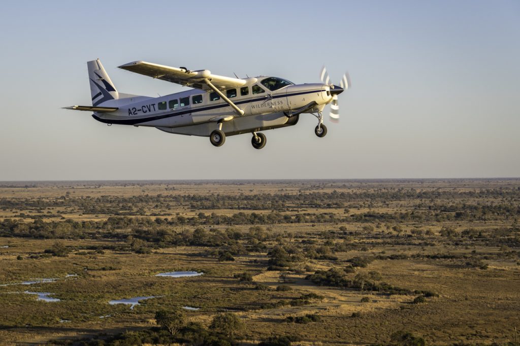 A Cessna Caravan like bush pilot Kirsty Henderson flies over private reserve Linyanti in Botswana.