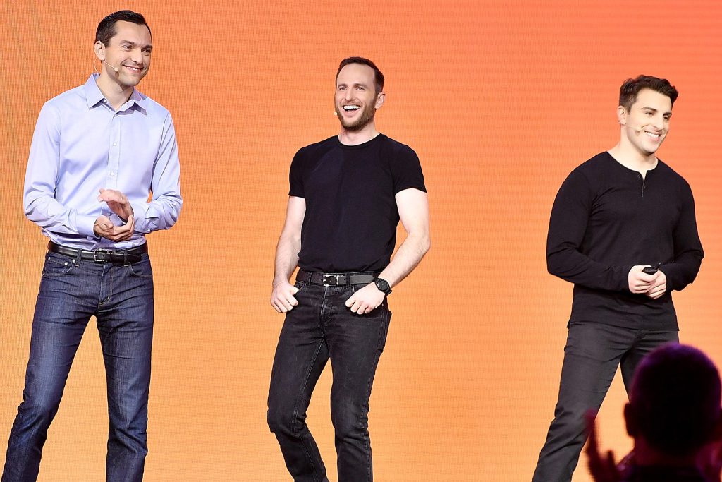 This November 17, 2016, photo shows Airbnb Founders, from left to right, Nathan Blecharczyk (now chief strategy officer and chairman of Airbnb China), Joe Gebbia (now head of product development team Samara), and CEO Brian Chesky speak onstage at the Airbnb Open event in Los Angeles. Airbnb is the best-funded travel startup in the world as of late 2019.