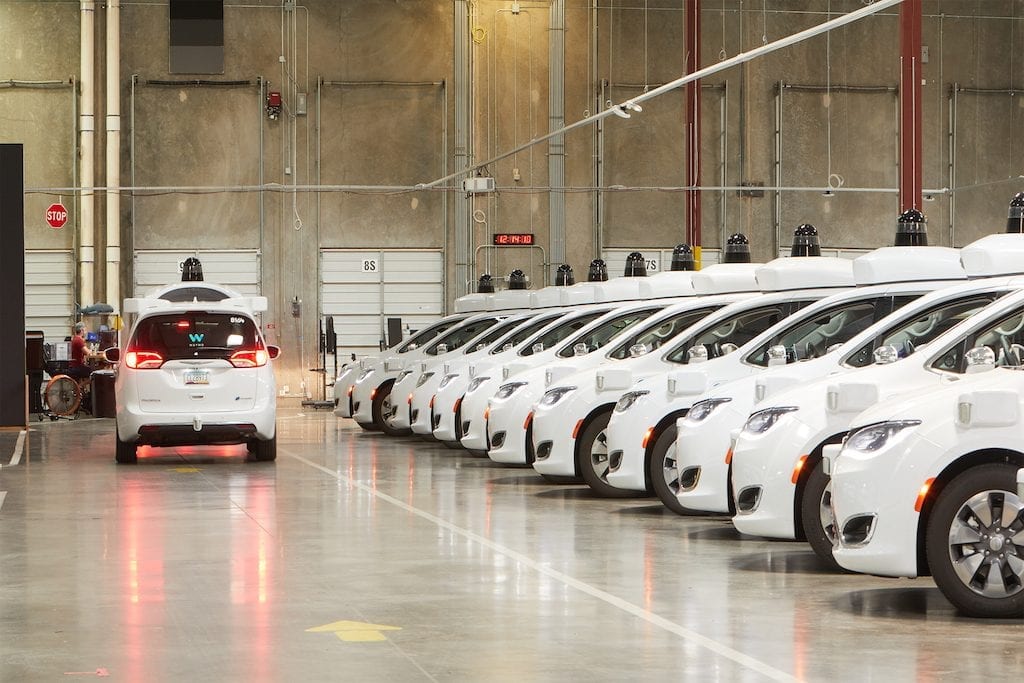 A garage filled with Waymo's self-driving cars. 