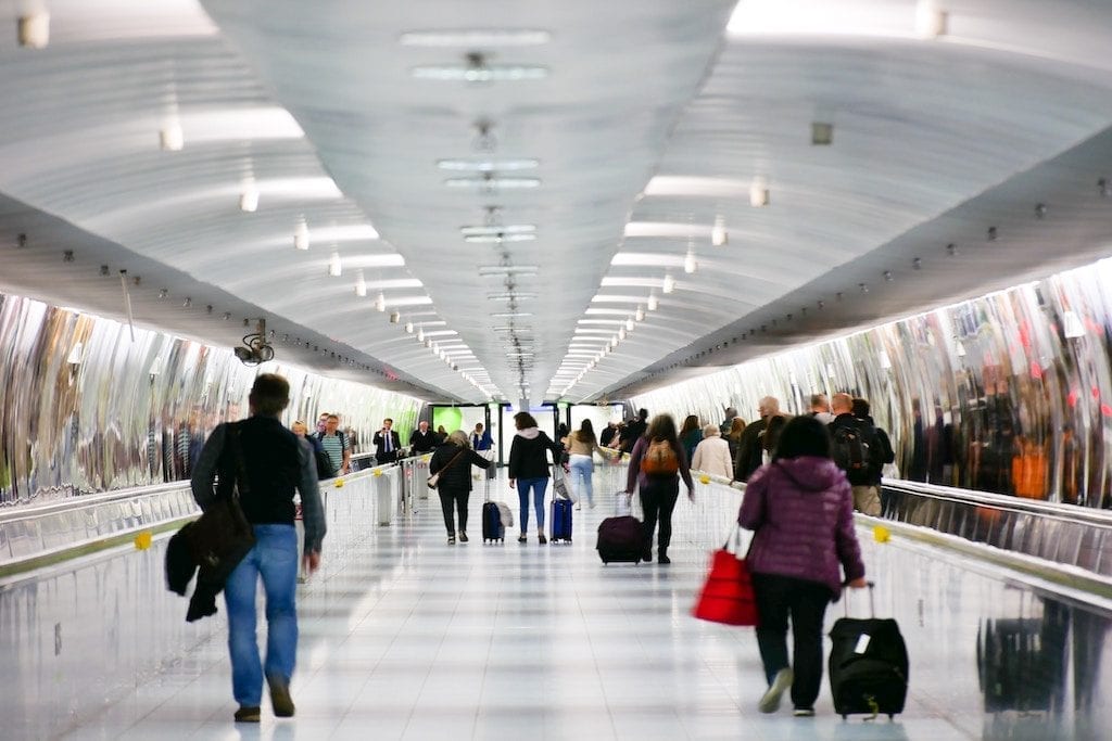 Skift Research uncovered a lot about travelers in 2019. Above, travelers walk through a terminal at Frankfurt Airport in Germany. 