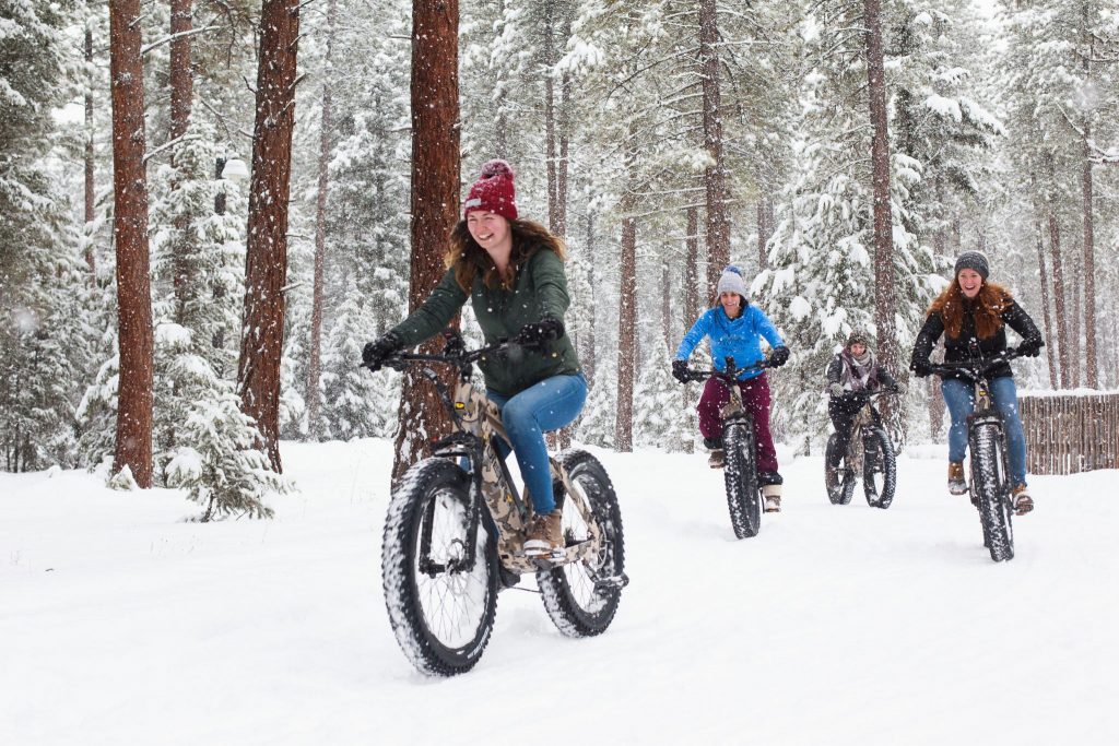 The Resort at Paws Up is one of many properties that offers eco-friendly, family-oriented activities like E-bike rides through the snow. Gen Z is increasingly influencing green travel trends by influencing their families' purchase decisions.