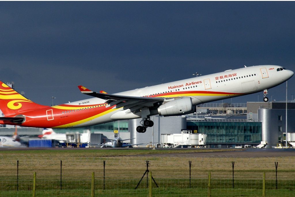 A Hainan Airlines plane taking off from Manchester Airport.