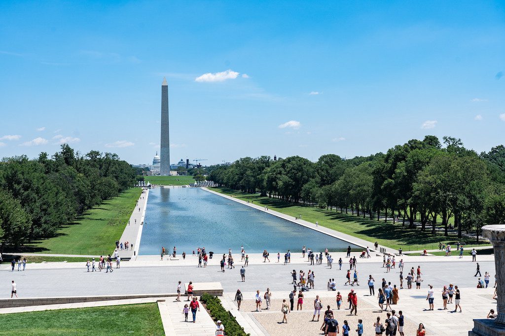 Tourists by the Lincoln Memorial Reflecting Pool in Washington, D.C. 