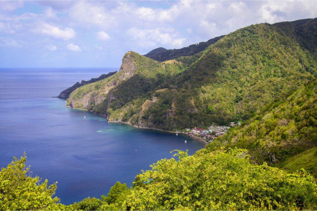 The village of Soufrière on the Caribbean island of Dominica, as seen from a viewpoint in Gallion, Dominica. Airfare wholesalers like Mondee help airlines sell tickets to agencies in ethnic communities, such as immigrants to the U.S. who may want to visit extended family in their hometowns in places like the Caribbean.