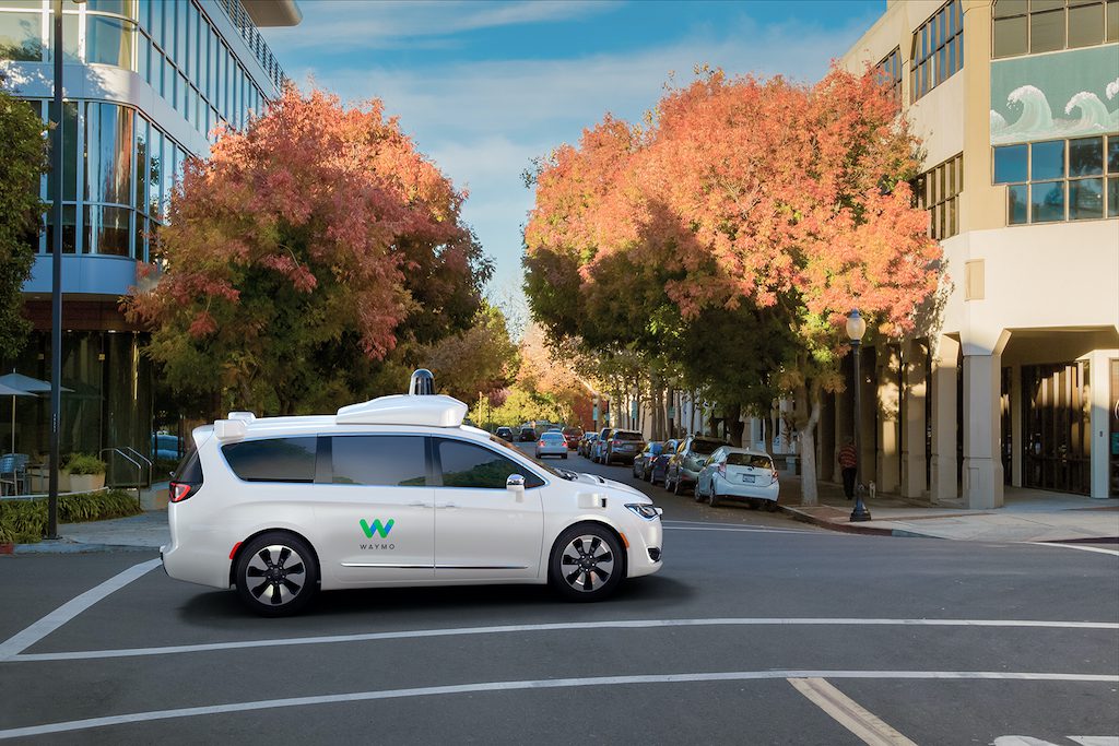 A Waymo self-driving minivan on city streets.