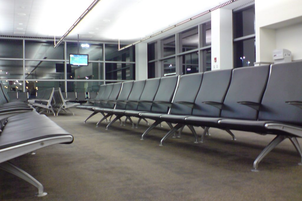 Empty airports like this one depicted here at Boston's Logan Airport will be a more common sight as the coronavirus unfolds.
