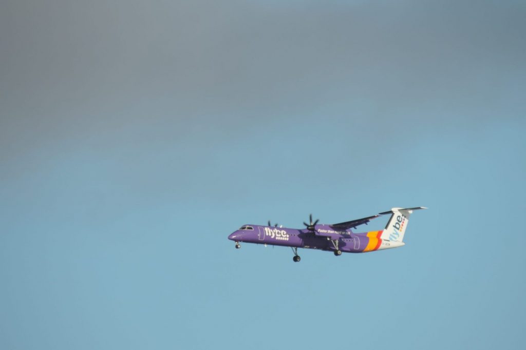 A Flybe aircraft in the sky. The airline has collapsed.