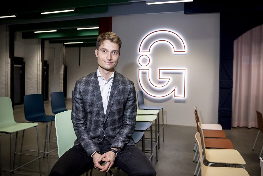 A January 2020, photo of Johannes Reck, Managing Director and co-founder of GetYourGuide, sits in front of the company logo after a panel discussion on the occasion of the visit of Federal Minister of Economics Altmaier to GetYourGuide's office in Berlin. GetYourGuide is an online travel agency.