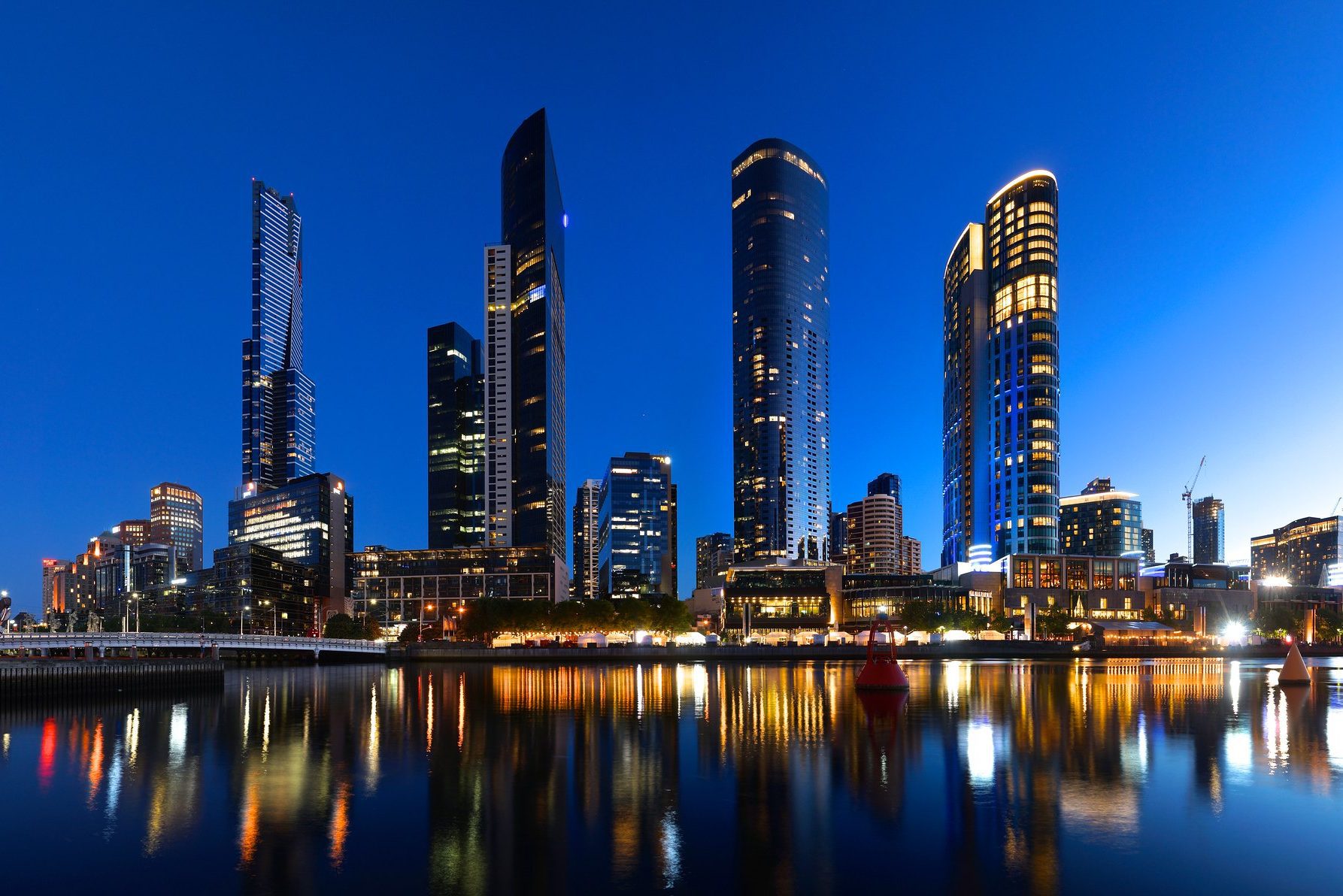 Southbank skyline from across the Yarra at sunset, with views of Eureka Tower, Freshwater Place, Prima Tower and Crown Tower, Melbourne in Victoria, Australia