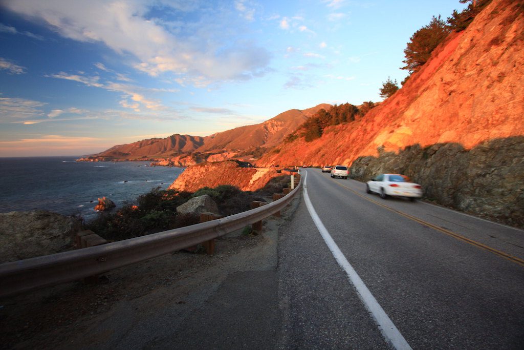 Highway along cliff overlooking water