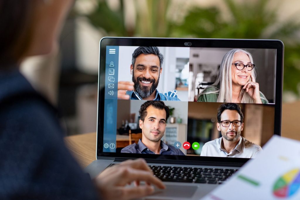 Woman working from home through video conference