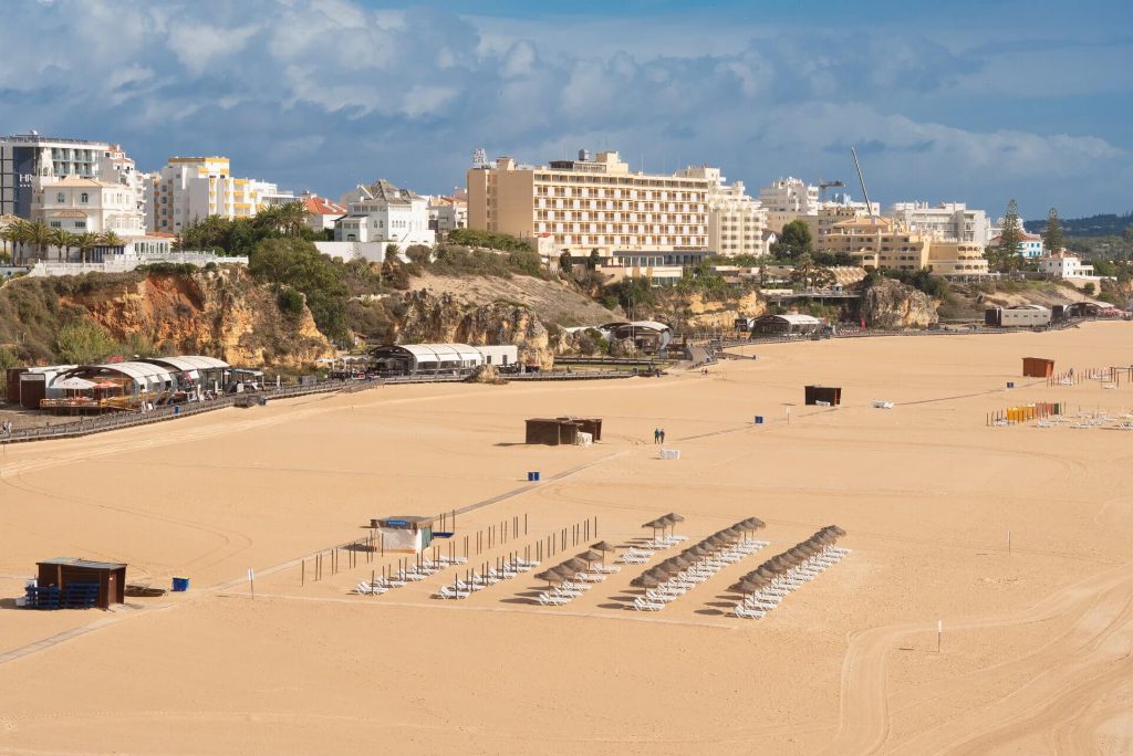 A beach in Portimão, Portugal. The national government says tourists are welcome in his country and no quarantine will be imposed on people arriving by plane.
