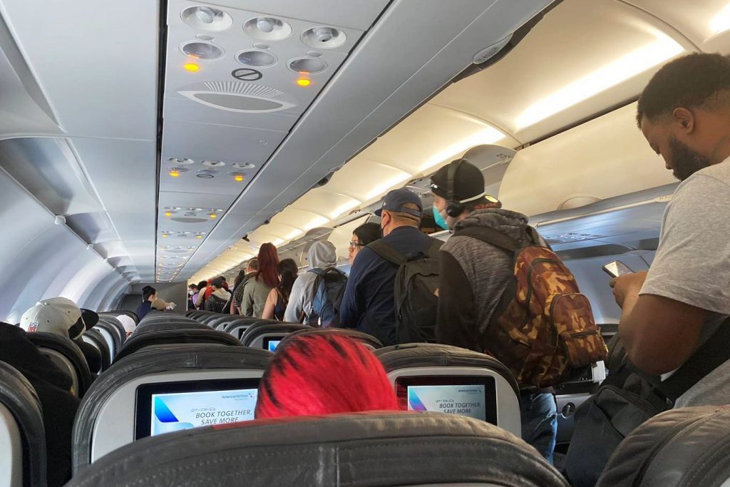 In this Monday, April 27, 2020 file photo, passengers get off an American Airlines flight after they landed at Los Angeles International Airport in Los Angeles. 