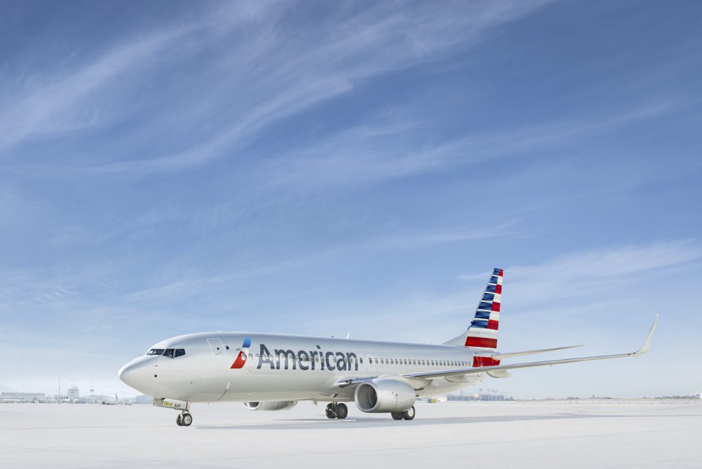An American Airlines Boeing 737 aircraft on the tarmac. American Airlines Group will adjust its long-haul international schedule for winter 2020 through summer 2021 to be down 25 percent from 2019 levels.