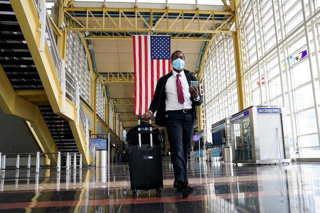 A passenger walks through Reagan National airport.