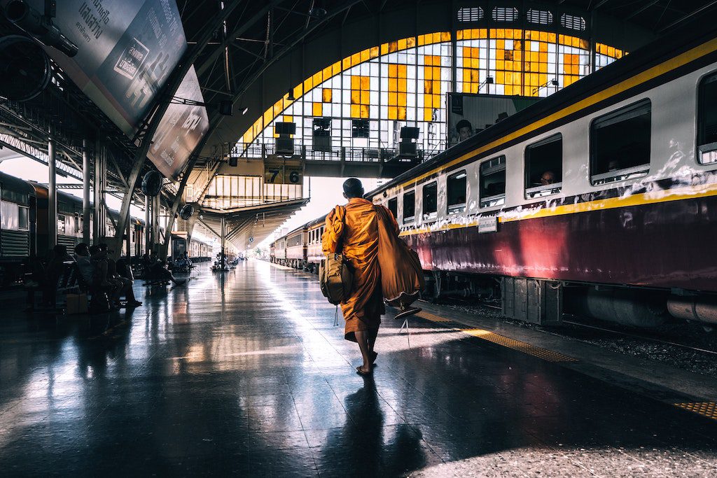 A man walks through Thailand's old train station.