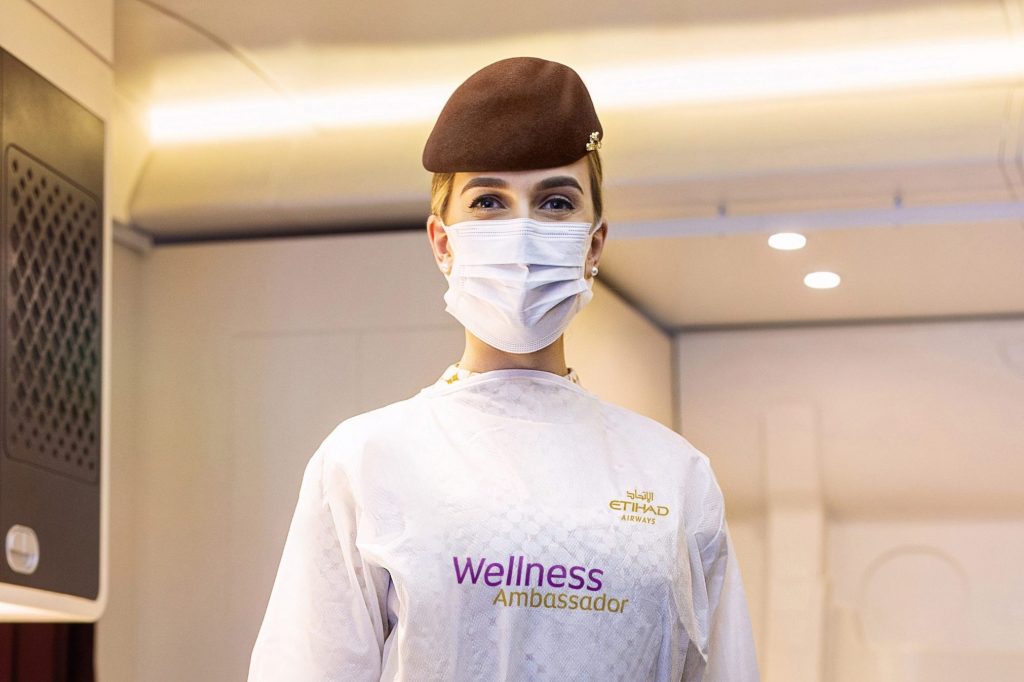 An Etihad Wellness Ambassador. The ambassadors will make guests feel safe and comfortable on board and will help make sure global health and hygiene regulations are being fully adhered to. 