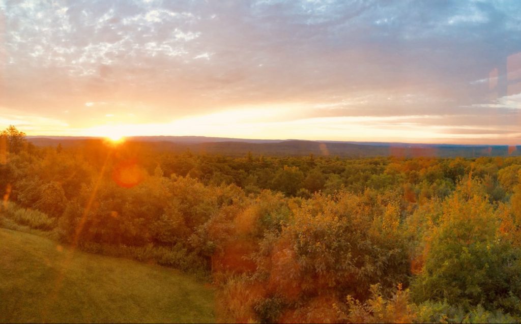 A burst of light at sunrise in the Catskill mountains near Woodstock, New York.