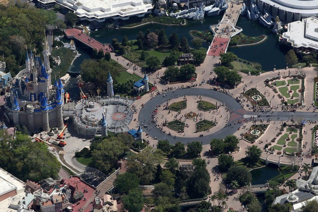 Crowds walk along Main Street toward Cinderella Castle and Tomorrowland at Disney's Magic Kingdom on the final day before closing in an effort to combat the spread of coronavirus disease, in an aerial view in Orlando, Florida, U.S. March 15, 2020. Picture taken March 15, 2020.