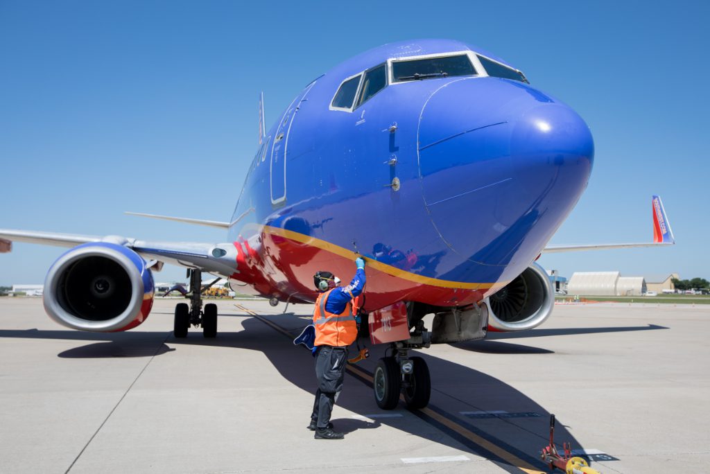 southwest airlines worker with plane spring 2020 source southwest airlines media page