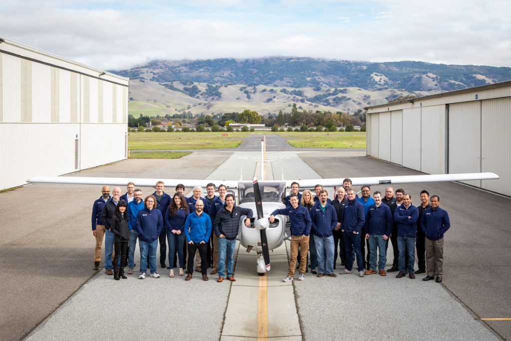 The Reliable Robotics team poses with an autonomous aircraft at its hangar in San Martin, California.