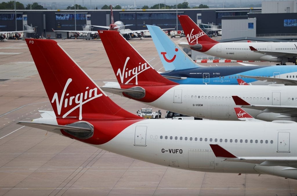 Virgin Atlantic and TUI Airways aircraft are seen at Manchester Airport, following the outbreak of the coronavirus disease, Manchester, Britain, June 8, 2020.