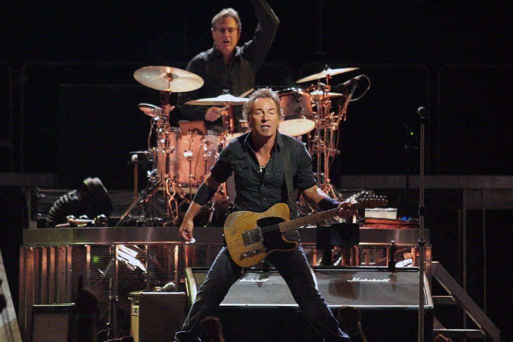 Bruce Springsteen Springsteen performing with drummer Max Weinberg behind him, on the Magic Tour stop at Veterans Memorial Arena, Jacksonville, Florida, August 15, 2008 source Craig ONeal wikipedia